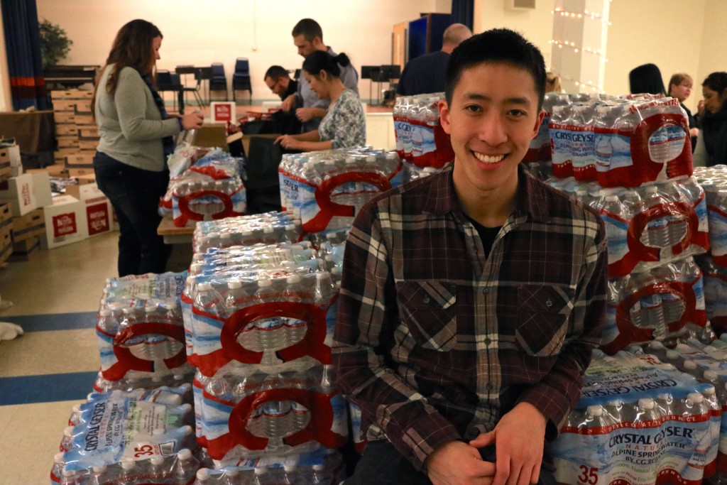 Eddie Wang poses during a Sleepless in Seattle volunteer event